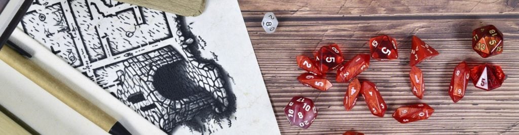 Playing dice and pencil drawing on wooden table